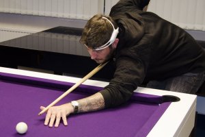 Playing pool whilst wearing a biometric monitor.