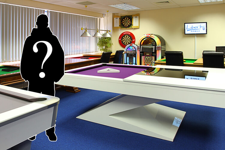 A mystery gamesologist standing in the Liberty Games showroom.