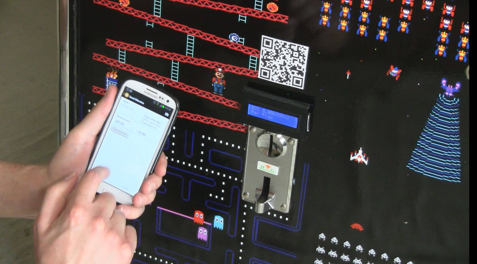 Phone paying for bitcoin arcade machine