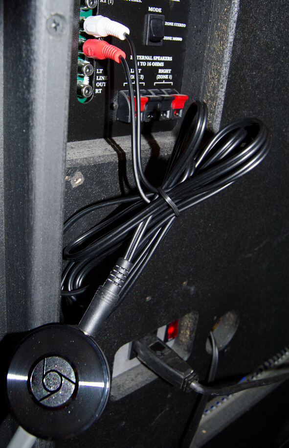 A chromecast audio being fitted to a jukebox