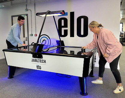 A branded air hockey table.