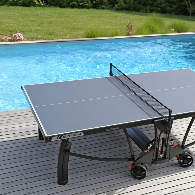 A 700M table tennis by a swimming pool