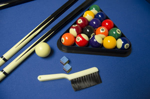 Chrome corner caps protect the pool table