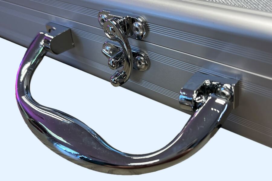 The Chrome cue case closing mechanism.