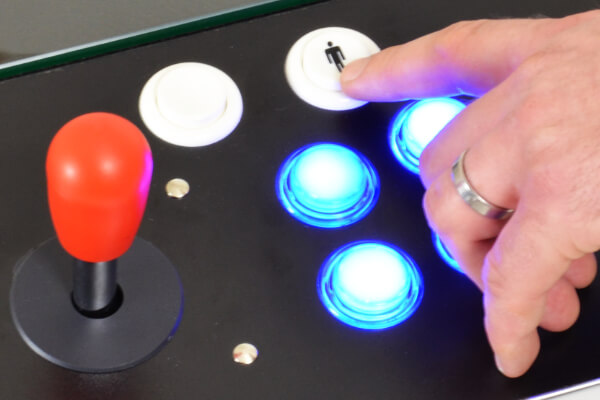 The coffee table arcade machine's 1p button.