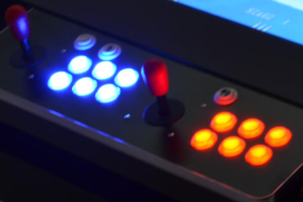 The coffee table arcade machine illuminated buttons.