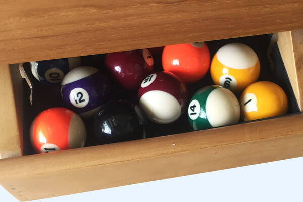 The ball drawer on the Precision pool table.