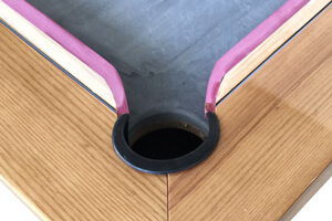 The cushion mount system of the Precision pool table.