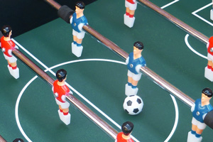 Players on the Shooter football table