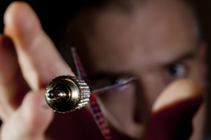 A darts player throwing a dart