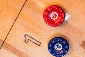 Pucks on the Grand Champion shuffleboard table