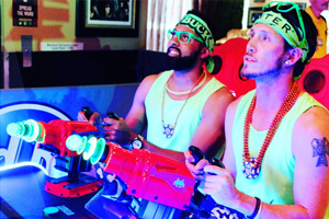 Players on the Space Invaders Frenzy arcade