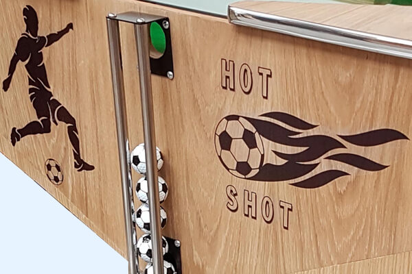 The ball chute on the Hot Shots game