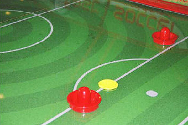 The playfield on the Fast Soccer air hockey table