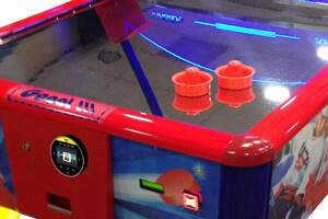 Contactless payment unit on an air hockey table