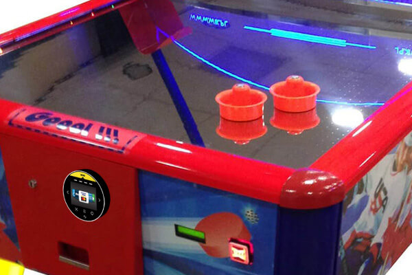 Contactless payment unit on an air hockey table