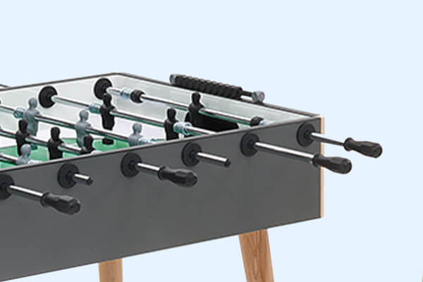 The side of a grey FAS Flamingo football table