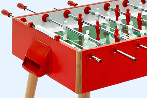 A goal side view of a red FAS Flamgino football table