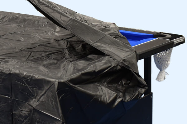 The Strikeworth cover being removed from a pool table.