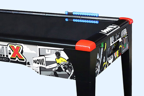 The Comix Home air hockey close up playfield.