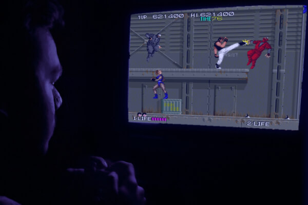 Playing a game on the Legends Core games console.