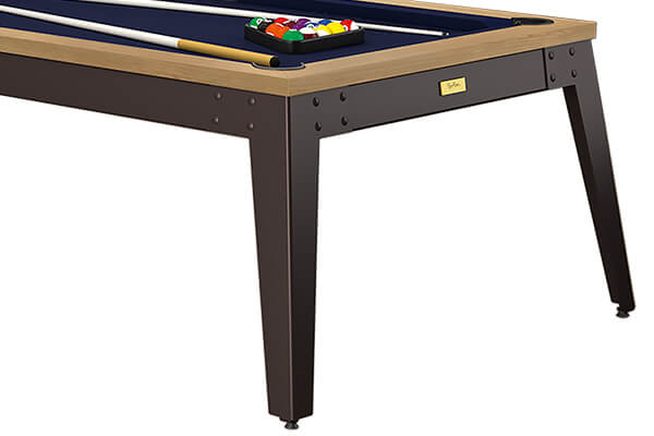 The pocket of a vintage snooker table.