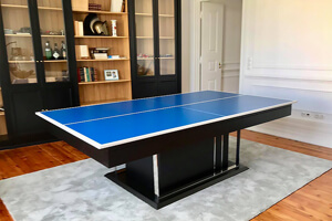 The London slate bed pool table in white in a room.