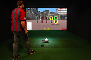 Playing football on the Sports Simulator.