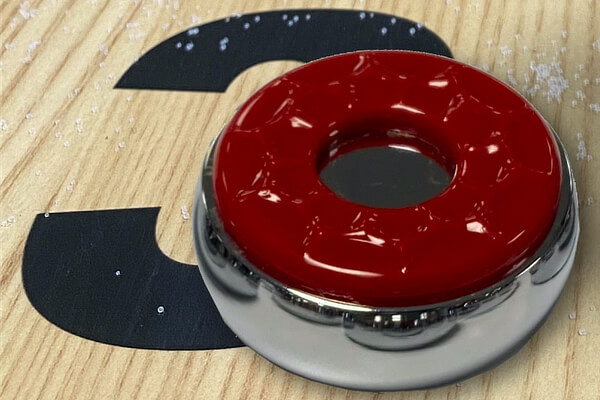 A Strikeworth shuffleboard puck.