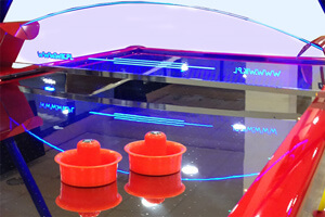 WIK Gold Commercial air hockey table in red close up.