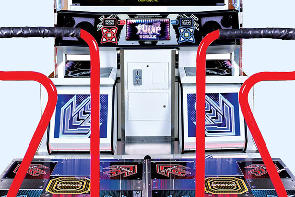 The Pump It Up arcade machine close up.