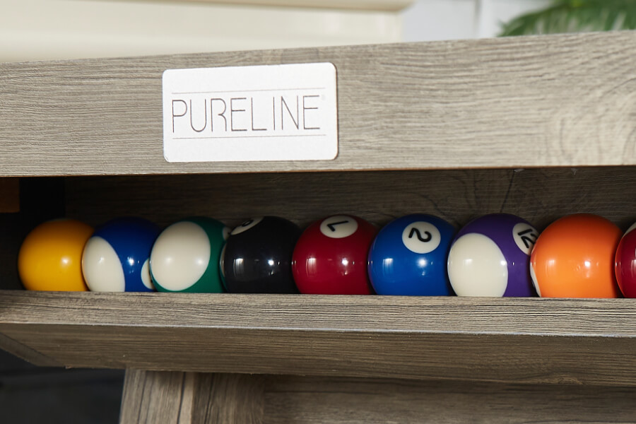 The rail on the Rustic Chic pool table.