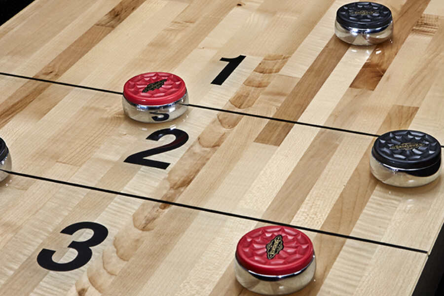 The Andover Shuffleboard Table with Included Accessories.