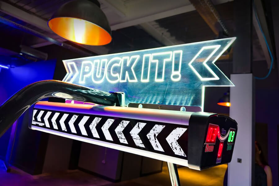 The Sega Puck It air hockey table sign.