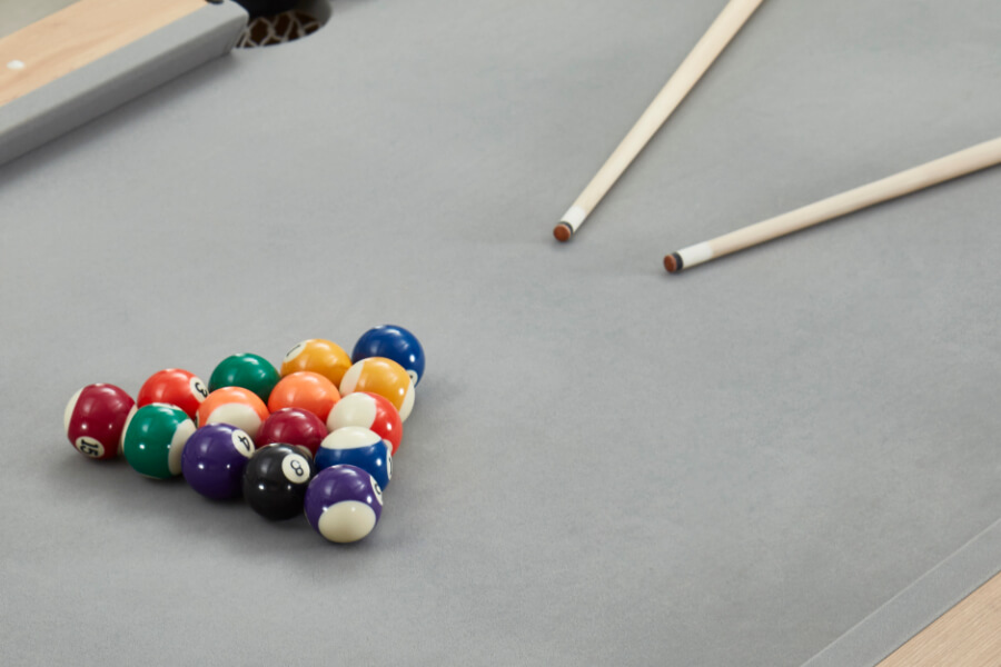 The accessories included with the Twist pool table.