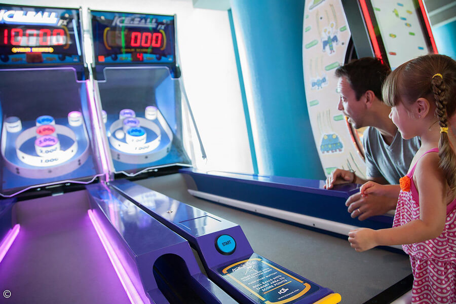 People playing Ice Ball FX Arcade Alley Bowler.
