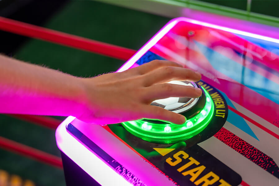 The World Football Pro Arcade Machine start button.