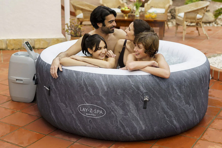 Family enjoying the Lay-Z-Spa Cancun AirJet Hot Tub.