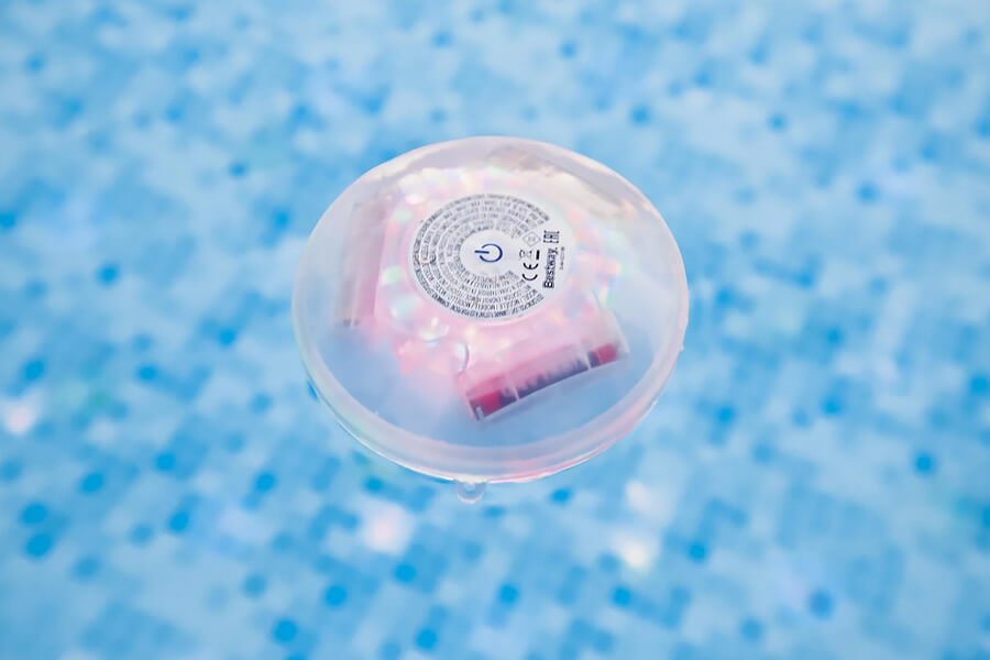 The Lay-Z-Spa Led Floating Pool Light in a pool.