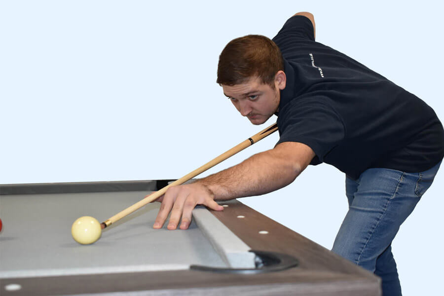 Man playing with Regent 57-Inch Two-Piece Pool Cue.