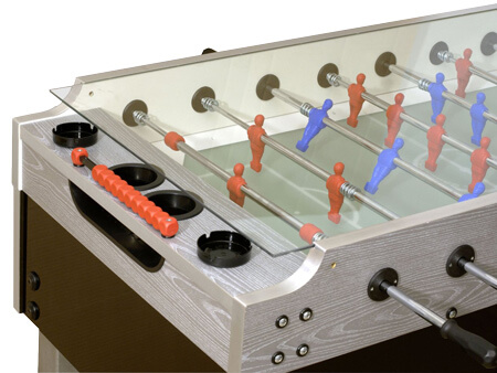 The glass top being removed from the Garlando Class football table.