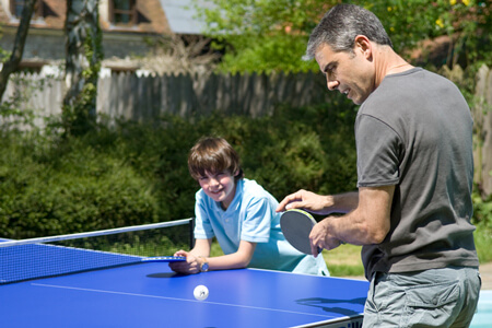 A Cornilleau outdoor pool table and family.