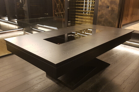 A pool table protected with a hard top.