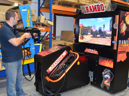 Play-testing the Rambo shooting machine.