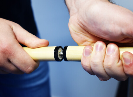 The screw joint in the centre of a pool cue.