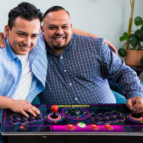Friends playing on the AtGames Gamer Pro arcade console.