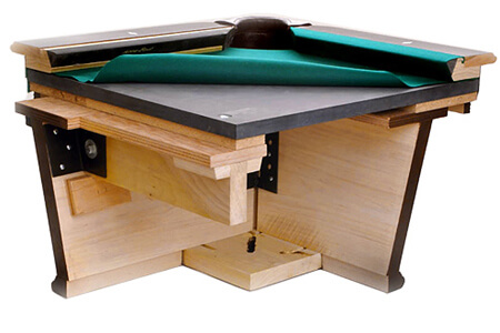 A pool table cutaway showing the slate bed.