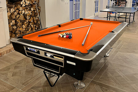 The LA Pro pool table with orange Elite Pro speed cloth.