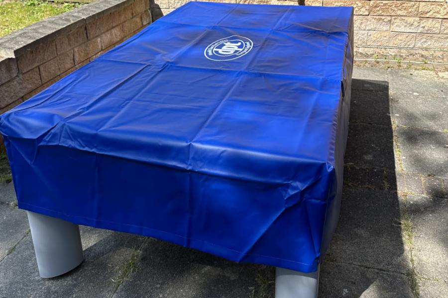 A covered outdoor pool table.