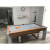 The Fusion pool dining table in Walnut.